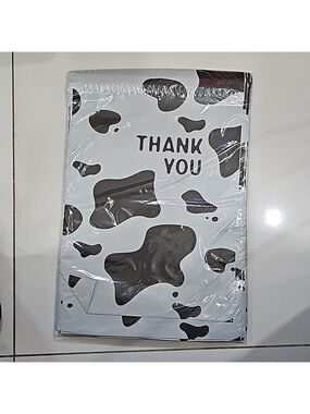 Ten 10x13 poly mailer in black & white cow print
